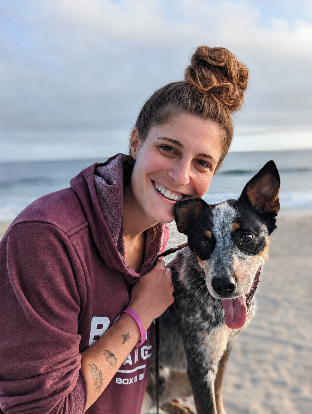 Jannah with her dog Hercules on the beach